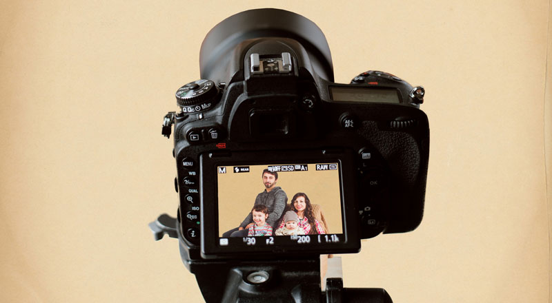 Instant Church Directory photo image of a back of a camera with a family showing through the viewfinder